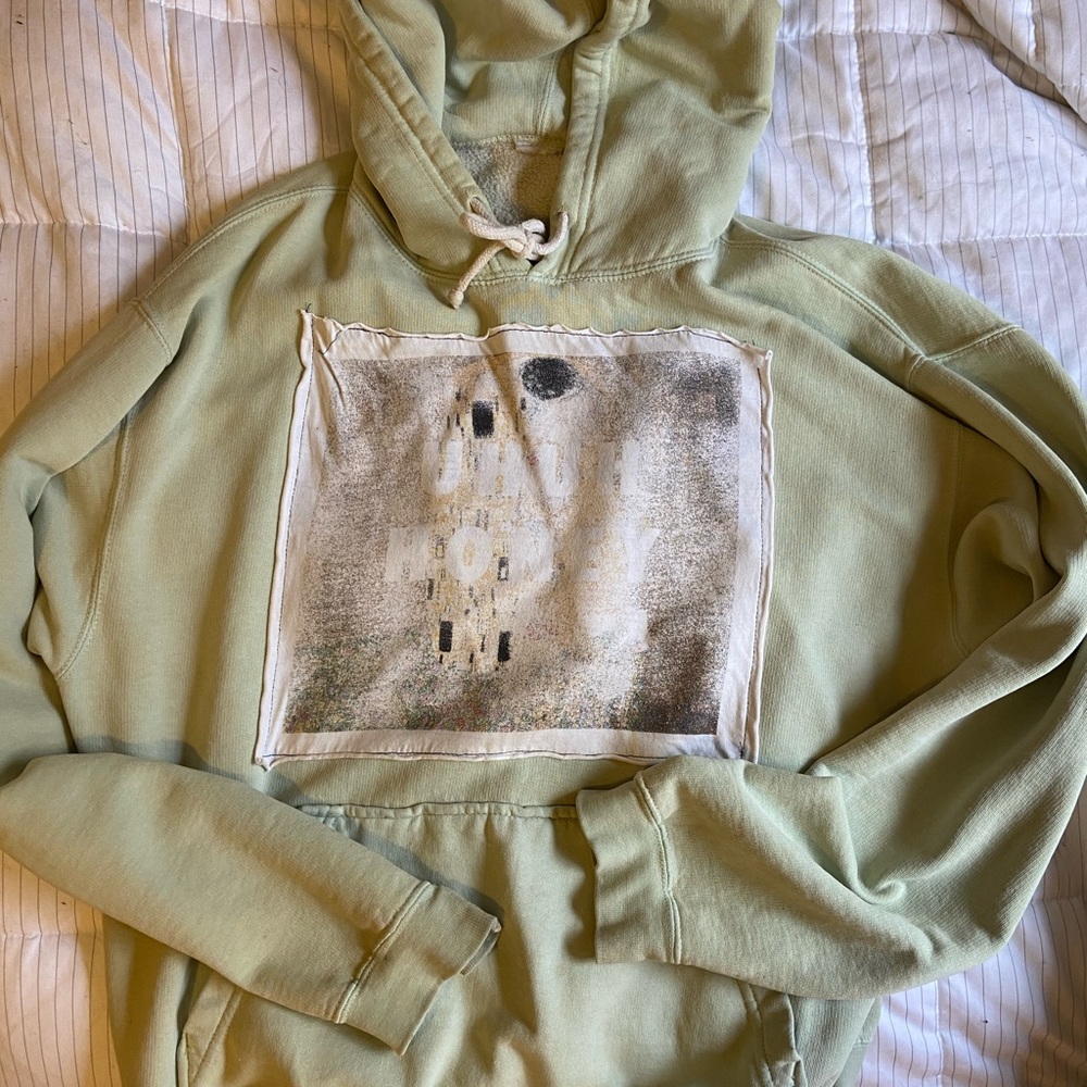 sage green hoodie with art